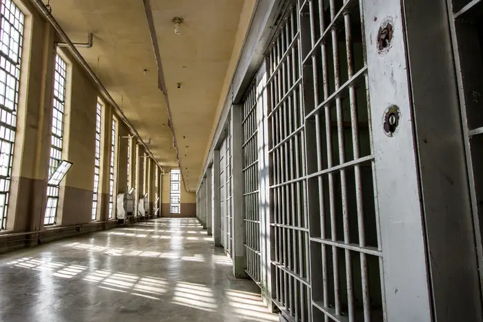 Interior shot of prison showing bars.